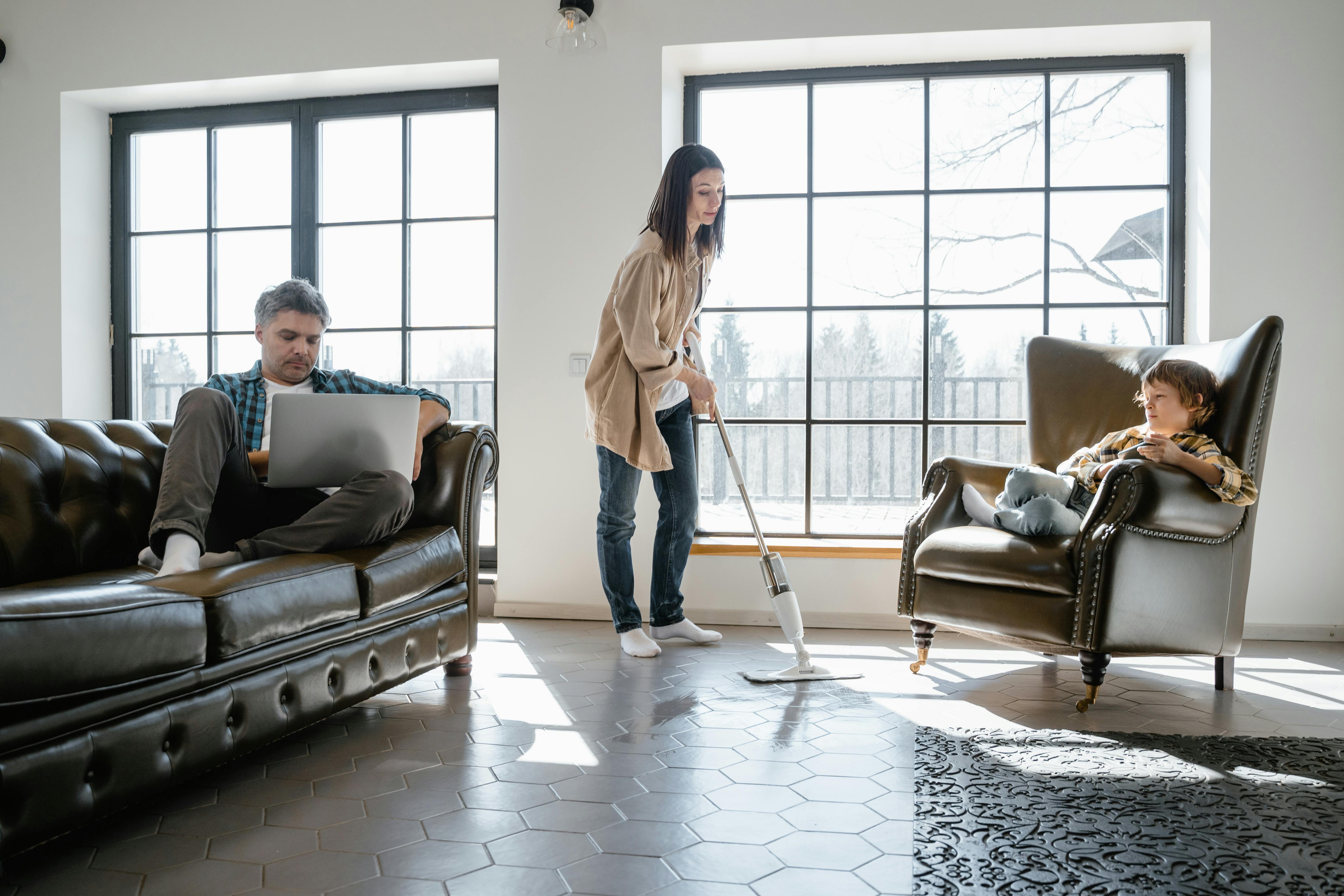 A family spending time together in a tidy living room.