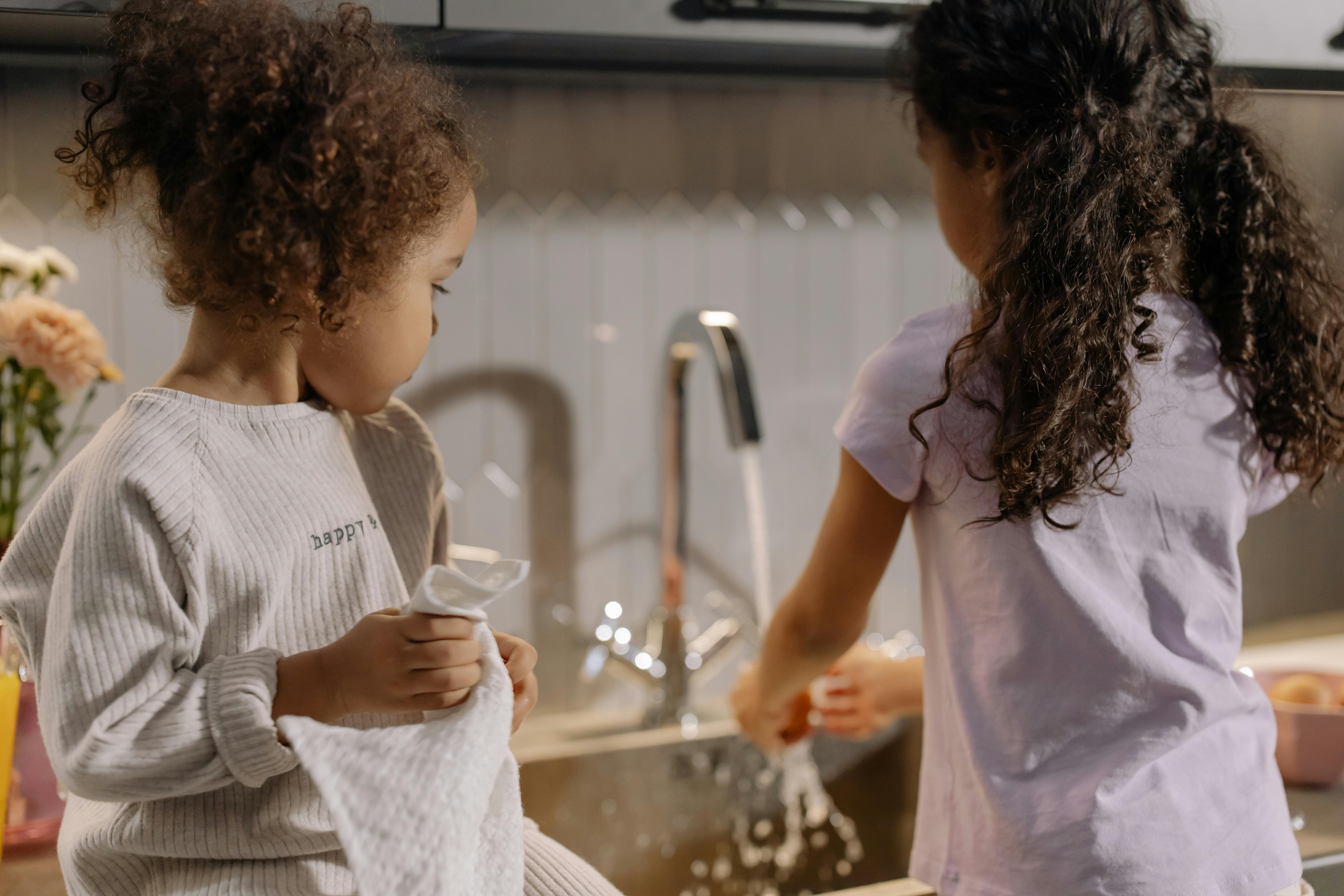 Children of different ages helping with age-appropriate chores
