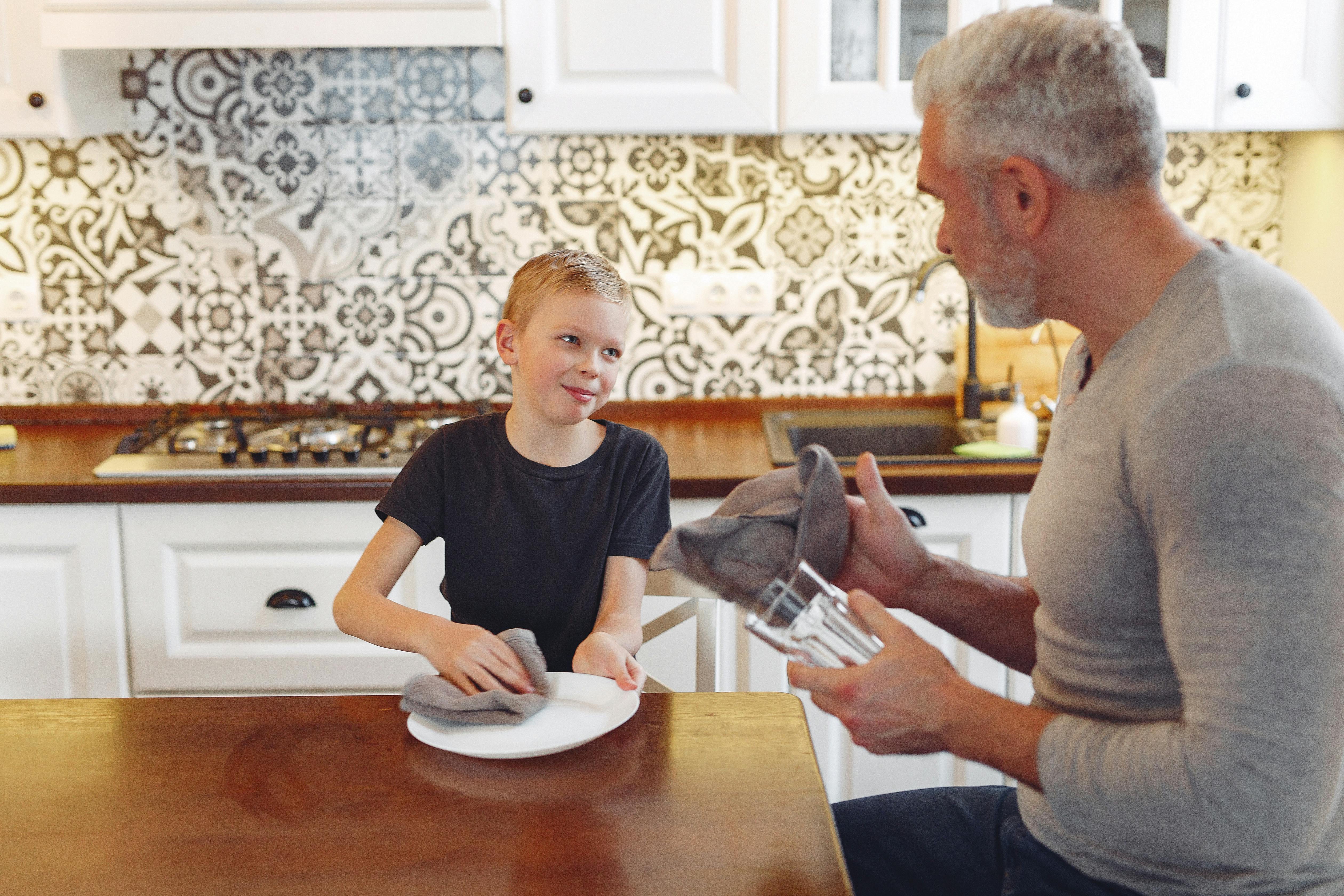 Child proudly finishing a simple household chore
