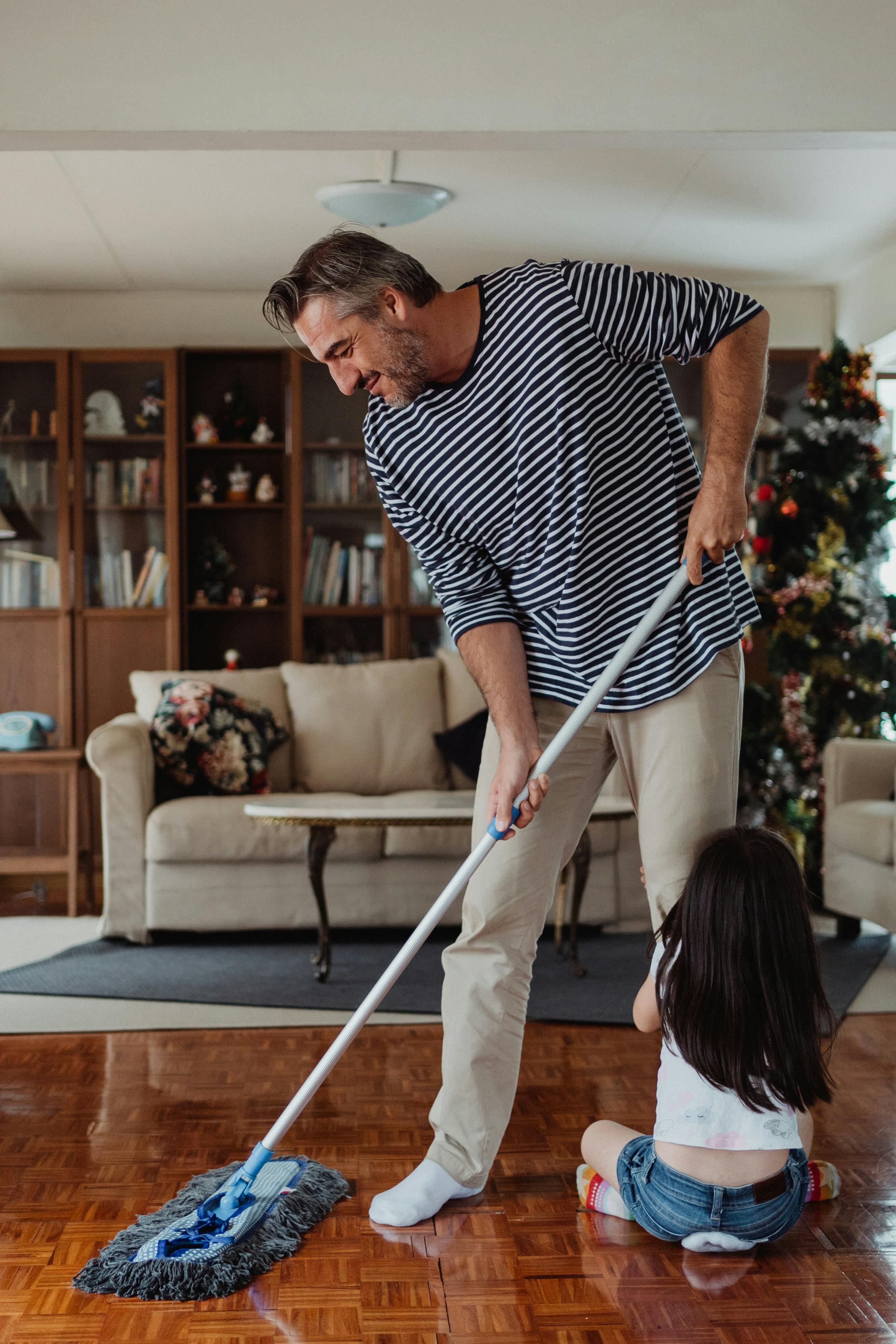 Parent and child working together on everyday chores at home